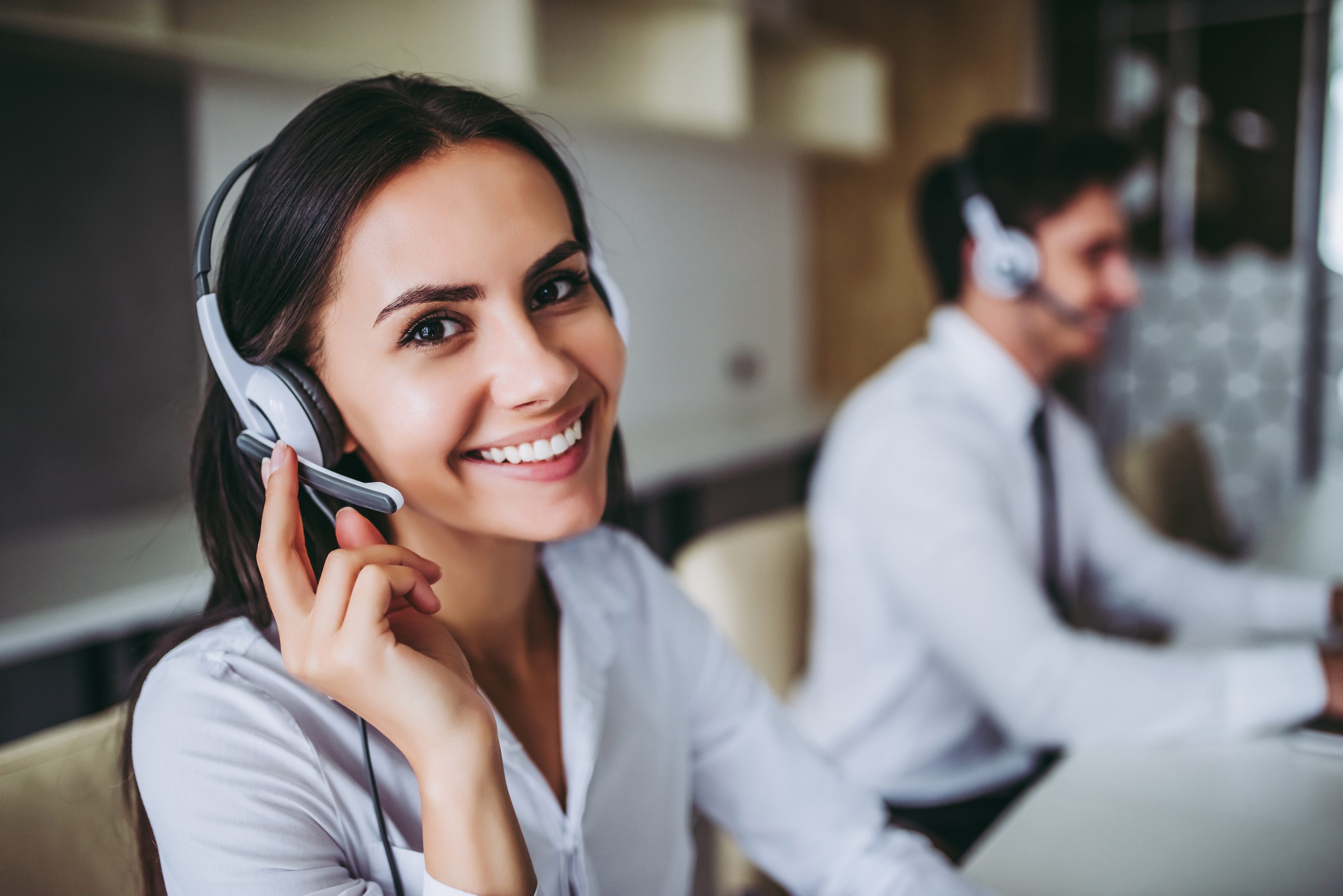Lady smiling to camera with headset