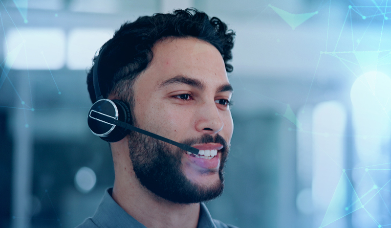 Man in a call centre with a headset on